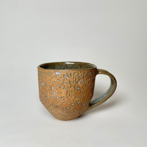 Taza grande café pasta expuesta esmalte verde moteado celeste. Redonda